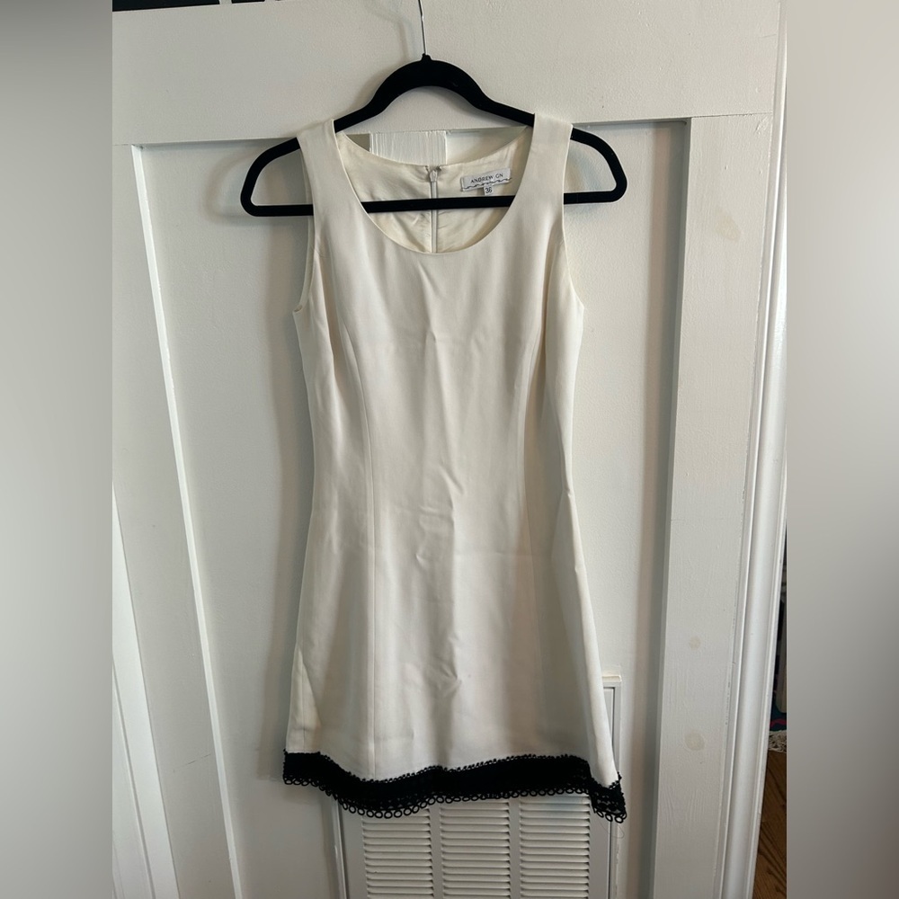 Andrew GN white shift dress with black lace trim